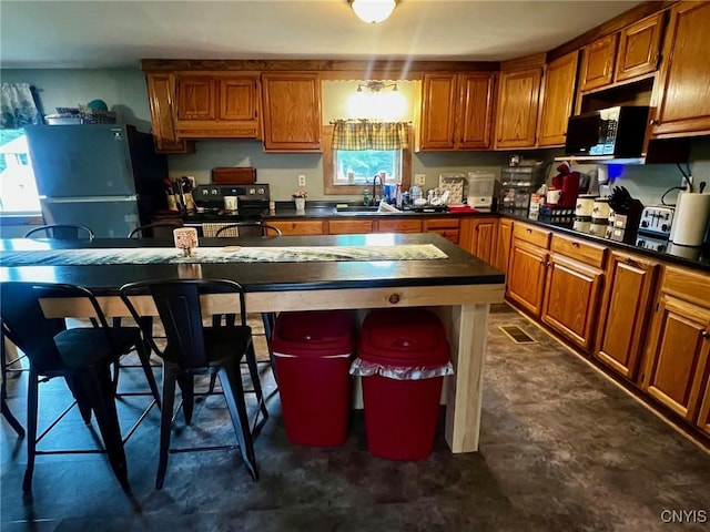 8 Office Rd, Fowler, NY 13642 - kitchen featuring freestanding refrigerator, black electric range, dark countertops, and a sink
