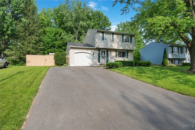 4287 Stepping Stone Ln, Clay, NY 13090 - colonial house with a garage, asphalt driveway, and a front yard