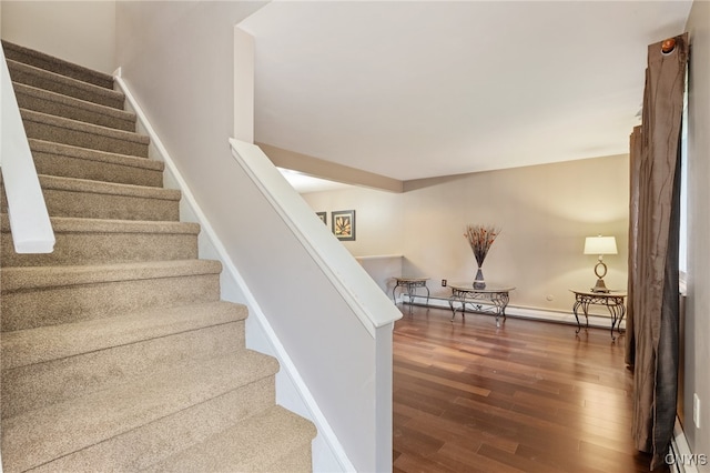 4287 Stepping Stone Ln, Clay, NY 13090 - stairway with wood finished floors, baseboards, and baseboard heating