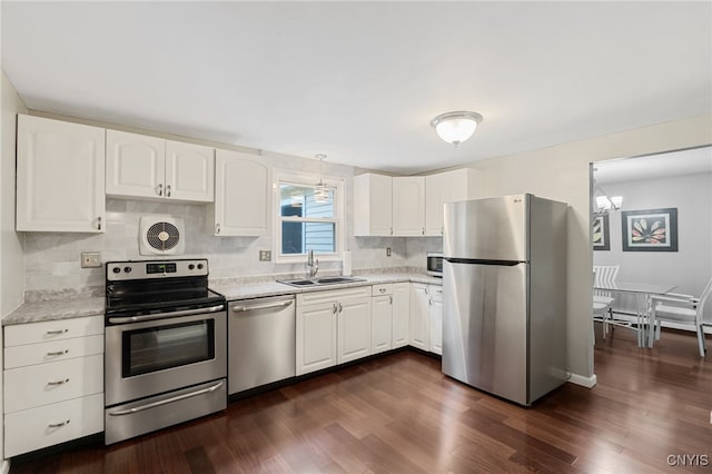 4287 Stepping Stone Ln, Clay, NY 13090 - kitchen with stainless steel appliances, a sink, light countertops, white cabinetry, and dark wood finished floors
