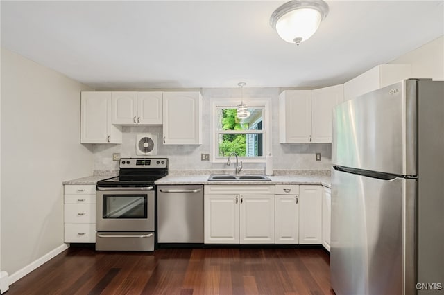 4287 Stepping Stone Ln, Clay, NY 13090 - kitchen with stainless steel appliances, a sink, light countertops, dark wood-style flooring, and white cabinets