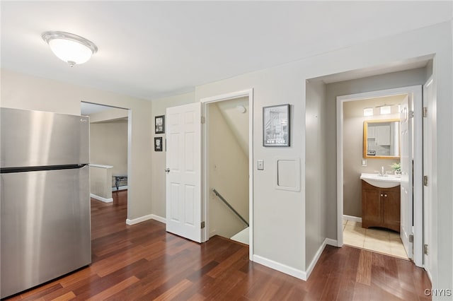 4287 Stepping Stone Ln, Clay, NY 13090 - kitchen featuring freestanding refrigerator, wood finished floors, baseboards, light countertops, and a sink