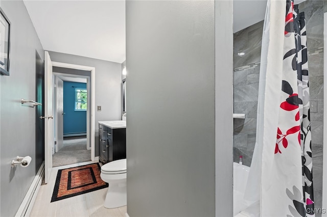 4287 Stepping Stone Ln, Clay, NY 13090 - full bath with toilet, vanity, a baseboard heating unit, a shower with curtain, and a baseboard radiator