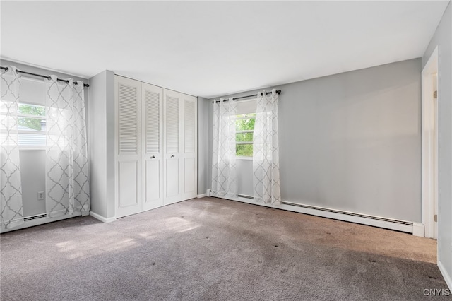 4287 Stepping Stone Ln, Clay, NY 13090 - unfurnished bedroom with a baseboard radiator, carpet flooring, multiple windows, and a closet
