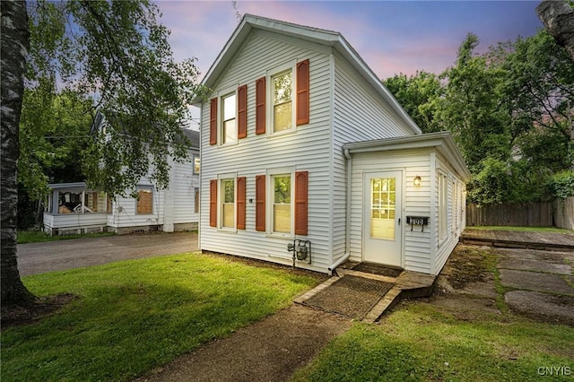 308 Lewis St, Syracuse, NY 13204 - back of property at dusk featuring asphalt driveway
