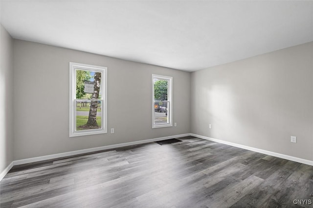 308 Lewis St, Syracuse, NY 13204 - unfurnished room with dark wood finished floors and baseboards