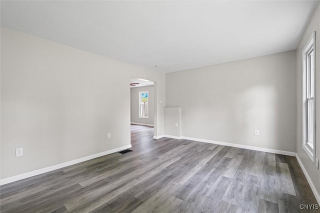 308 Lewis St, Syracuse, NY 13204 - empty room featuring dark wood-type flooring and baseboards