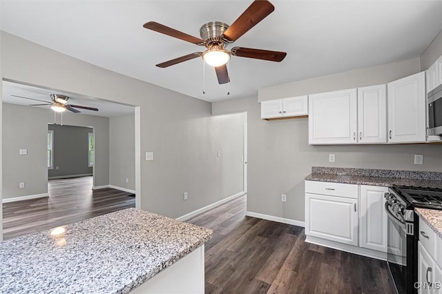 308 Lewis St, Syracuse, NY 13204 - kitchen with a ceiling fan, black gas range oven, dark wood finished floors, and light stone countertops