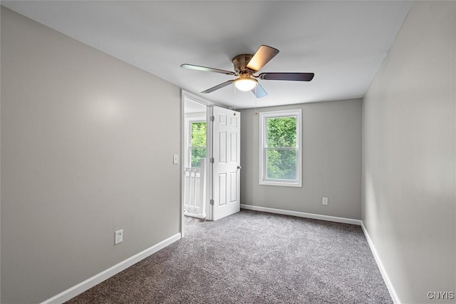 308 Lewis St, Syracuse, NY 13204 - unfurnished bedroom with carpet flooring, baseboards, and a ceiling fan