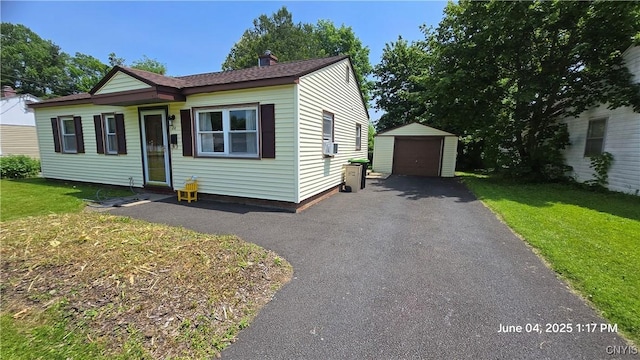 24 Pinecrest Rd, Whitestown, NY 13492 - view of front of home with a detached garage, an outdoor structure, driveway, and a front yard
