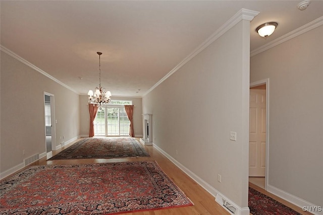 207 Falling Brook Path, Manlius, NY 13066 - hallway featuring ornamental molding, a chandelier, light wood-type flooring, and baseboards