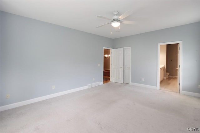 207 Falling Brook Path, Manlius, NY 13066 - unfurnished bedroom with light carpet, baseboards, connected bathroom, and ceiling fan