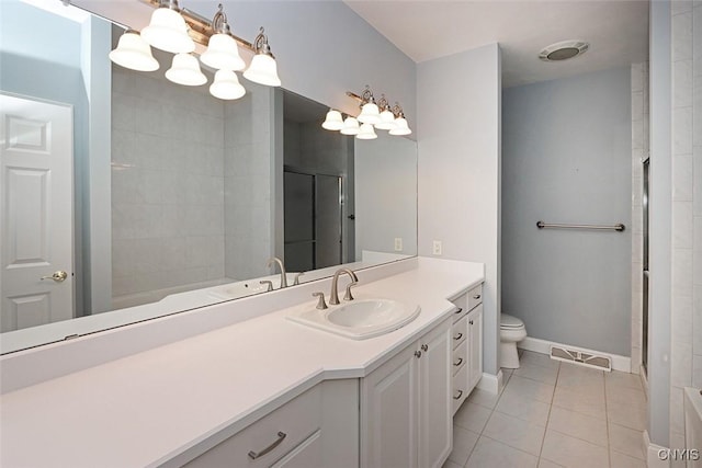 207 Falling Brook Path, Manlius, NY 13066 - full bath with tile patterned floors, vanity, toilet, a shower with shower door, and baseboards