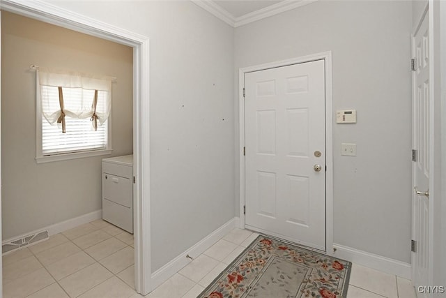 207 Falling Brook Path, Manlius, NY 13066 - entrance foyer with crown molding, washer / dryer, baseboards, and light tile patterned floors