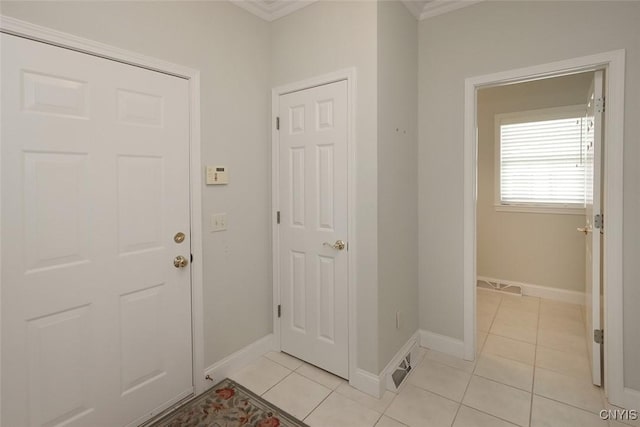 207 Falling Brook Path, Manlius, NY 13066 - entrance foyer with light tile patterned floors, crown molding, and baseboards