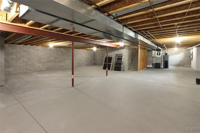207 Falling Brook Path, Manlius, NY 13066 - unfinished basement with water heater, stairway, and heating unit