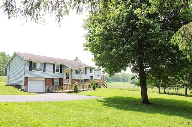 465 Blanding Rd, Sherburne, NY 13460 - split foyer home with driveway, a front lawn, and a garage