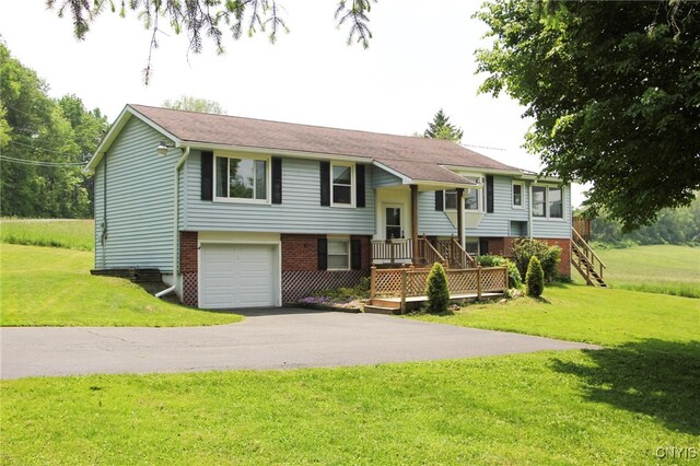 465 Blanding Rd, Sherburne, NY 13460 - bi-level home with asphalt driveway, an attached garage, a front yard, and brick siding
