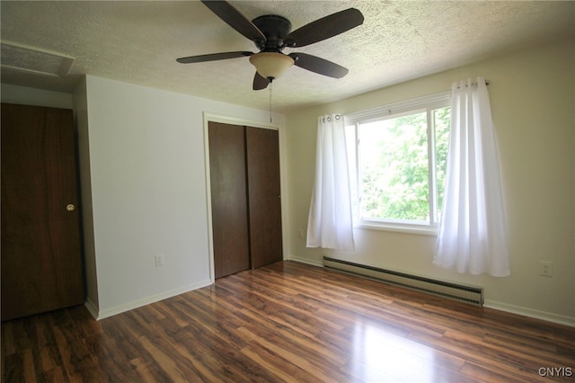 465 Blanding Rd, Sherburne, NY 13460 - unfurnished bedroom featuring a baseboard radiator, wood finished floors, a closet, a textured ceiling, and attic access