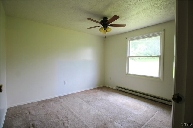 465 Blanding Rd, Sherburne, NY 13460 - unfurnished room with baseboard heating, carpet floors, ceiling fan, baseboards, and a textured ceiling
