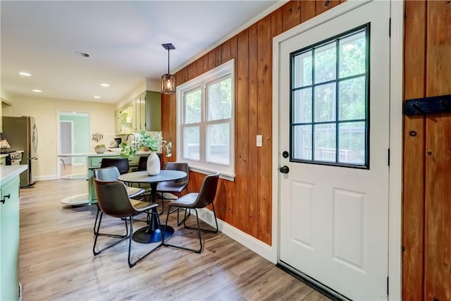 12 Edgewood Dr, Penfield, NY 14526 - dining room with healthy amount of natural light, baseboards, light wood-type flooring, wooden walls, and recessed lighting