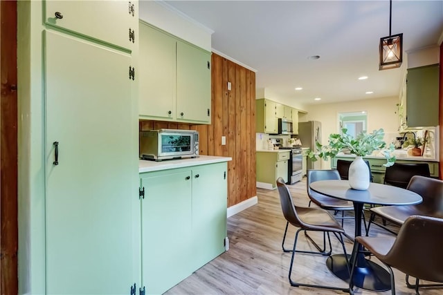 12 Edgewood Dr, Penfield, NY 14526 - kitchen featuring appliances with stainless steel finishes, light wood finished floors, light countertops, baseboards, and recessed lighting