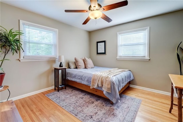 12 Edgewood Dr, Penfield, NY 14526 - bedroom with wood finished floors, baseboards, and a ceiling fan