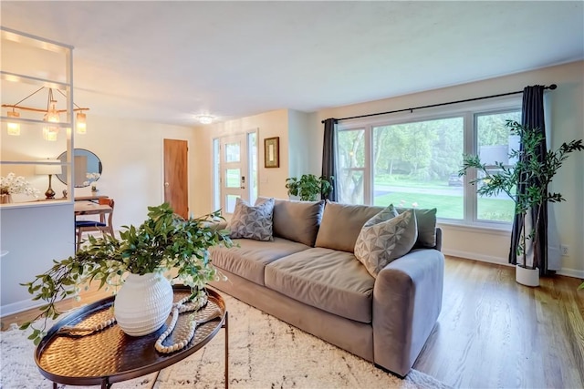 12 Edgewood Dr, Penfield, NY 14526 - living room featuring wood finished floors and baseboards