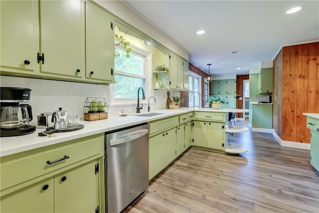 12 Edgewood Dr, Penfield, NY 14526 - kitchen with dishwasher, a sink, a peninsula, light countertops, and recessed lighting