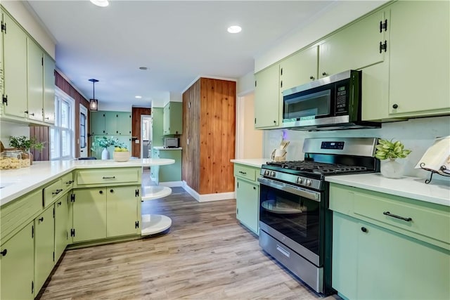 12 Edgewood Dr, Penfield, NY 14526 - kitchen with appliances with stainless steel finishes, light countertops, light wood-style floors, a peninsula, and recessed lighting