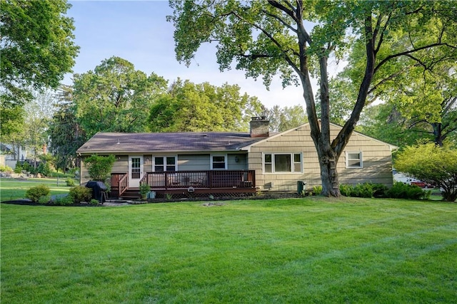 12 Edgewood Dr, Penfield, NY 14526 - view of front of property featuring a deck, a front yard, and a chimney