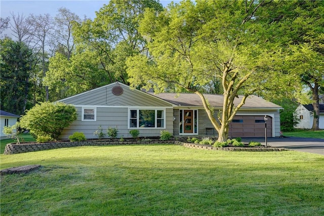 12 Edgewood Dr, Penfield, NY 14526 - ranch-style house with asphalt driveway, a garage, and a front yard