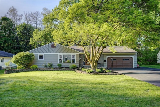 12 Edgewood Dr, Penfield, NY 14526 - single story home with driveway, an attached garage, and a front lawn