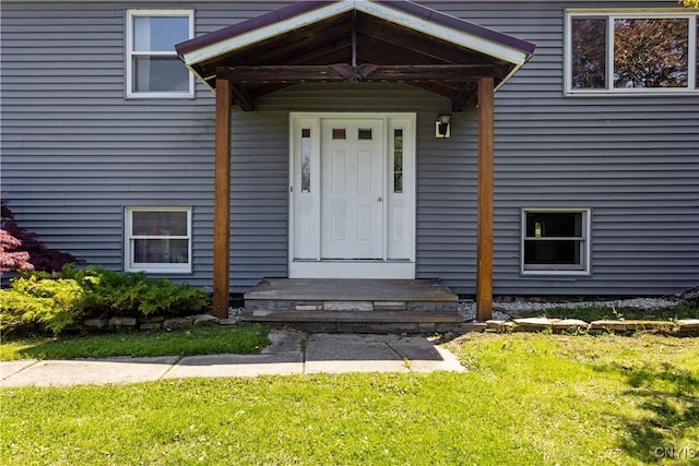 5750 Sentinel Heights Rd, Onondaga, NY 13078 - view of exterior entry with a lawn