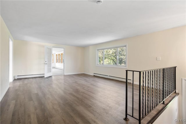 5750 Sentinel Heights Rd, Onondaga, NY 13078 - unfurnished room featuring a baseboard heating unit, wood finished floors, baseboard heating, and baseboards