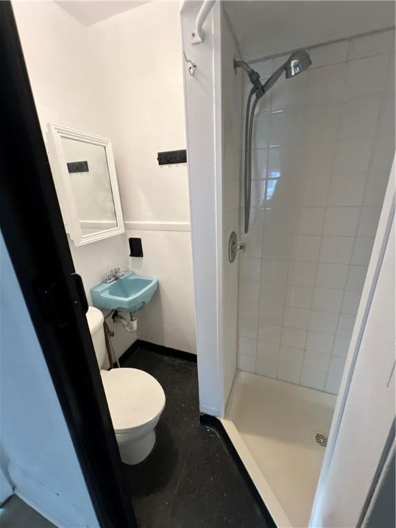58 Mayflower St, Rochester, NY 14615 - bathroom with toilet, a stall shower, and a sink