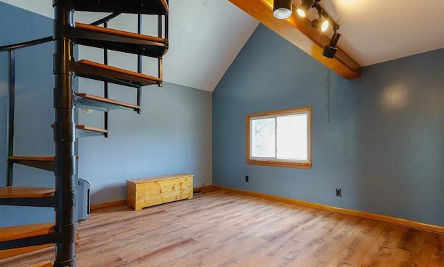58 Mayflower St, Rochester, NY 14615 - unfurnished bedroom with lofted ceiling, wood finished floors, and baseboards