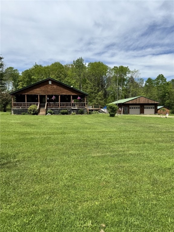 18 Memorial Dr, Otto Twp, PA 16729 - view of green lawn featuring a garage
