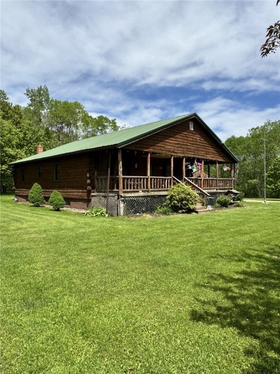 18 Memorial Dr, Otto Twp, PA 16729 - view of front of house with a front lawn, a porch, and a chimney
