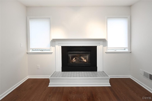 442 Summerhaven Dr N, Manlius, NY 13057 - detailed view of wood finished floors, baseboards, and a fireplace with raised hearth