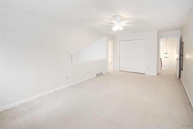 442 Summerhaven Dr N, Manlius, NY 13057 - unfurnished bedroom featuring a closet, light colored carpet, baseboards, and ceiling fan