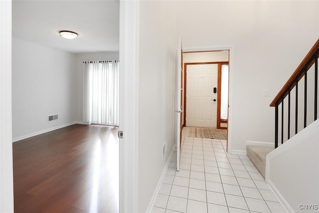 442 Summerhaven Dr N, Manlius, NY 13057 - foyer entrance featuring stairs, baseboards, and light wood-style flooring