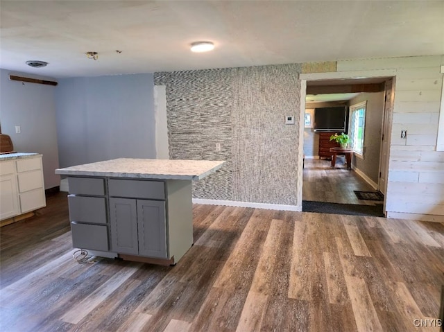 2484 State Route 31, Sullivan, NY 13032 - kitchen featuring gray cabinetry, dark wood-style floors, a center island, and baseboards