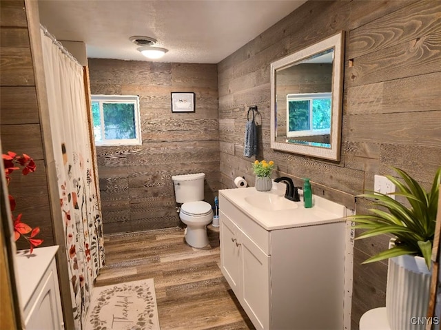 2484 State Route 31, Sullivan, NY 13032 - full bathroom featuring toilet, vanity, wood walls, wood finished floors, and a shower with shower curtain