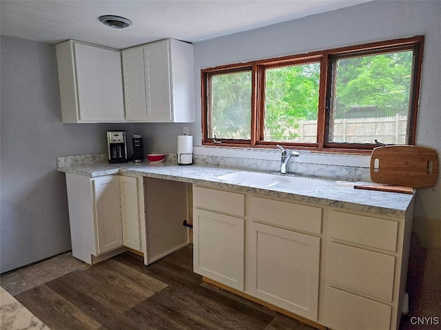 2484 State Route 31, Sullivan, NY 13032 - kitchen with a sink, dark wood-style floors, white cabinetry, and plenty of natural light