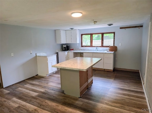 2484 State Route 31, Sullivan, NY 13032 - kitchen featuring white cabinetry, dark wood finished floors, a center island, and a sink