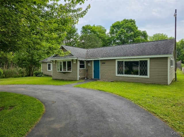 2484 State Route 31, Sullivan, NY 13032 - view of front of home with a front yard, driveway, and a shingled roof