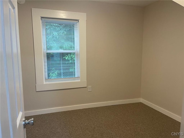 530 Lenox Ave, Oneida, NY 13421 - empty room with baseboards and dark carpet