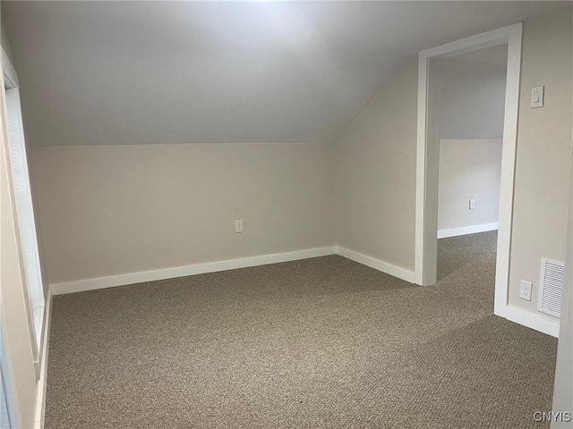 530 Lenox Ave, Oneida, NY 13421 - additional living space with dark carpet and lofted ceiling