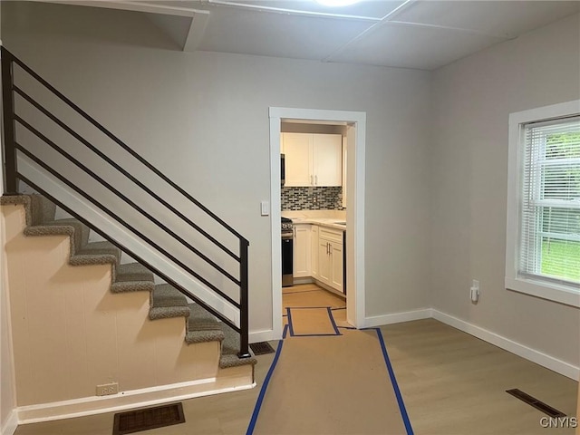 530 Lenox Ave, Oneida, NY 13421 - staircase featuring baseboards and wood finished floors